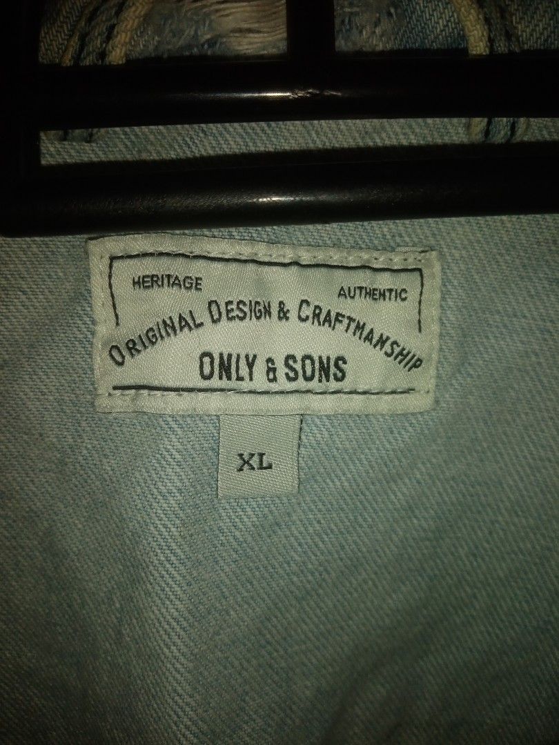 ONLY & SONS XL Light Wash Distressed Denim Jacket (Category: Coats, Jackets and Outerwear) located in General Trias. Submitted by joyjoson (Listing ID 1448489910, Image 2). Description: - Brand: ONLY & SONS - Type: Light Wash Denim Jacket - Size: XL - Style: Distressed, ripped look - Features: Classic button-up, chest pockets - Versatility: Great for layering, pairs well with any outfit.