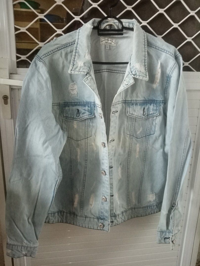 ONLY & SONS XL Light Wash Distressed Denim Jacket (Category: Coats, Jackets and Outerwear) located in General Trias. Submitted by joyjoson (Listing ID 1448489910, Image 3). Description: - Brand: ONLY & SONS - Type: Light Wash Denim Jacket - Size: XL - Style: Distressed, ripped look - Features: Classic button-up, chest pockets - Versatility: Great for layering, pairs well with any outfit.
