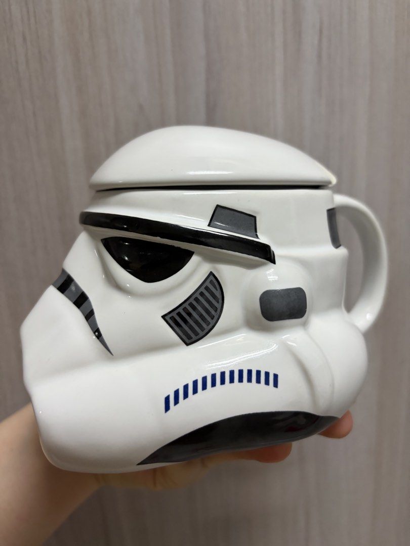 Painted Star Wars Stormtrooper Helmet Mug with Lid (Category: Coffee & Tea Tableware) located in Taguig. Submitted by labellearmoire2 (Listing ID 1448691300, Image 3). Description: - Unique Star Wars Stormtrooper helmet mug - Includes a lid to keep drinks warm - Sturdy ceramic construction with a comfortable handle - Ideal for coffee, tea, or any hot beverage - A must-have for any Star Wars fan! Bumped the top of it accidentally while using only 