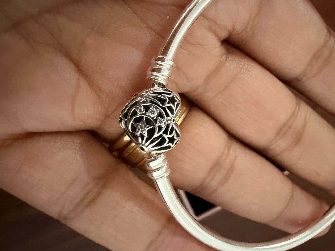 Pandora Sterling Silver Bangle Bracelet with Heart Clasp (Category: Bracelets) located in Makati City. Submitted by izzie_stevensoo7 (Listing ID 1448622850, Image 3). Description: - Authentic Pandora Sterling Silver Bangle - Features a beautiful heart-shaped clasp with intricate detailing and small stones - Comes with original Pandora box - Made in Thailand - Perfect for adding charms or wearing as is -Orig Price: 2500 -Without paper bag.