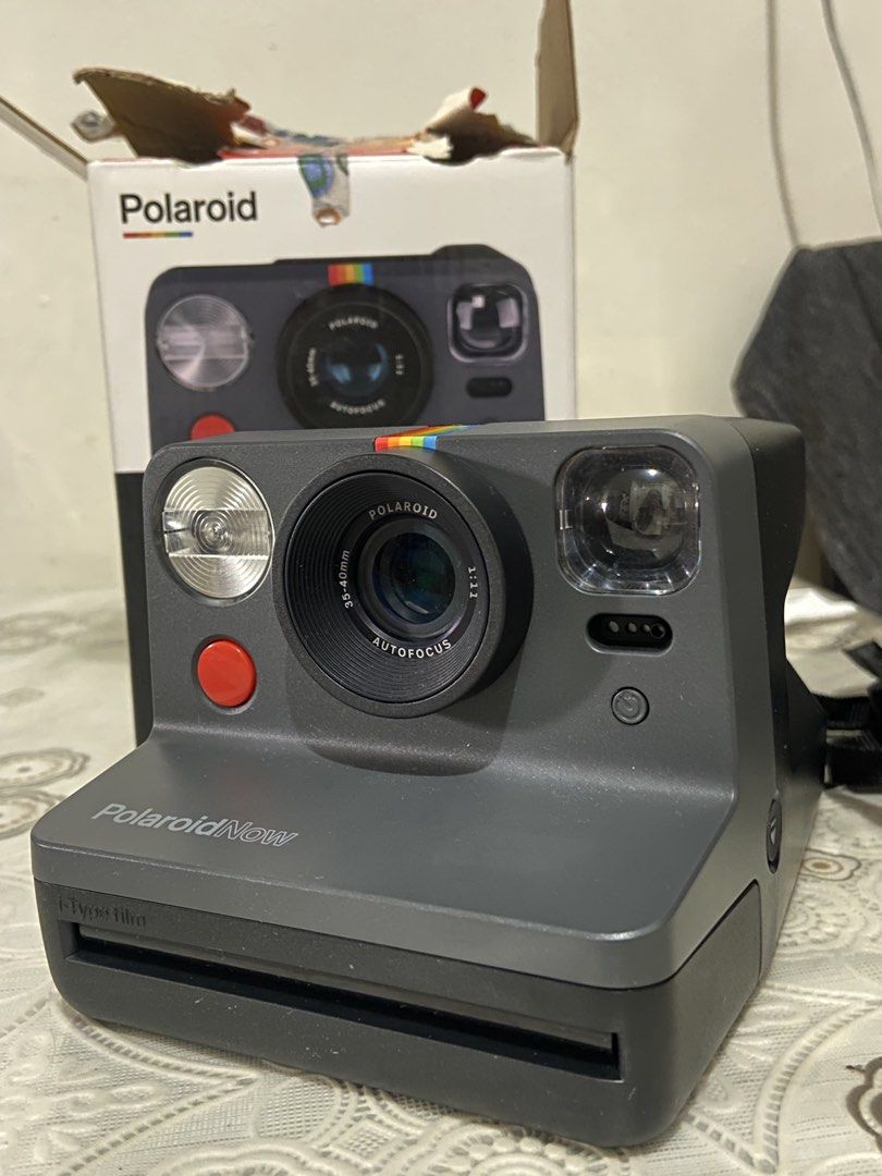 Polaroid Now Autofocus I-Type Instant Camera (Category: Cameras) located in Manila. Submitted by mielzshrin74260 (Listing ID 1448512110, Image 2). Description: Features ALL FEATURES ARE WORKING Self-timer & double exposure modes Classic look made of 40% recycled material Accurate, human-friendly flash Up to 15 film packs battery life Tripod mount Custom design shutter system, using precision step motor for shutter Six useable apertures ranging fr