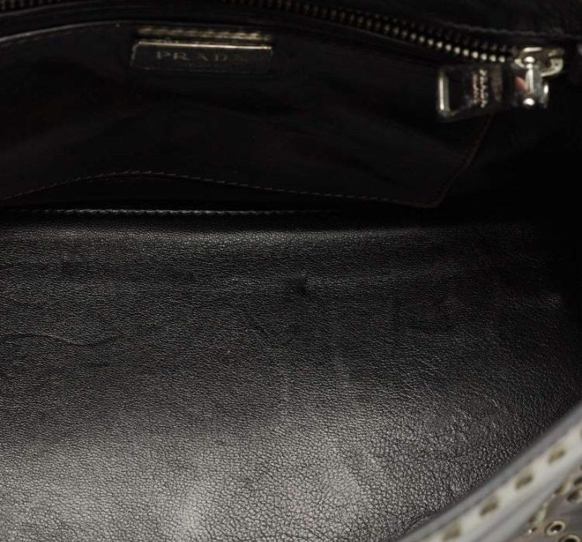 Prada (Category: Luxury Bags & Wallets) located in Muntinlupa City. Submitted by mabelleadr46801 (Listing ID 1448619497, Image 3). Description: ✨SALE✨ Prada Vitello Vintage Studded Sound Top Handle Bag in the dark brown shade known as Ebano. Key CharacteristicsCollection Era: Released around 2010 as part of Prada’s vintage-inspired, heavily embellished leather lineups. Material: Distressed, richly grained Vitello Vintage calfskin leather.Hardware