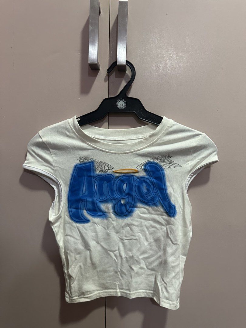 Printed White Crop Top (Category: Shirts) located in Cabanatuan. Submitted by sabbbiee (Listing ID 1448645572, Image 2). Description: 🌷 Decluttering my closet! Selling my pre-loved clothes that are still in great condition. Affordable prices, well-loved, and located in Cabanatuan City. Shipping fee is shouldered by the buyer. Feel free to message me for more details! 💕.