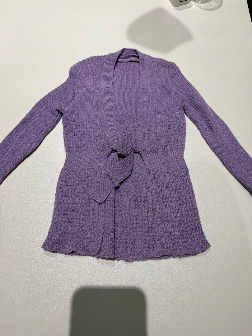 Purple Knit Cardigan with Tie (Category: Babies & Kids Fashion) located in San Juan City. Submitted by closetsale28 (Listing ID 1448519729, Image 1). Description: - Cozy purple knit cardigan - Features a stylish tie closure at the front - Ribbed detailing on sleeves and hem - Unique textured knit pattern on the body - Ideal for layering over your favorite outfits.