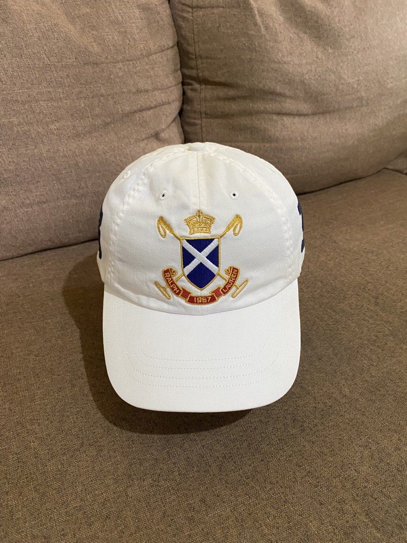 Ralph Lauren Black Watch Polo Team (Category: Caps & Hats) located in Cebu City. Submitted by patspickph (Listing ID 1448546535, Image 1). Description: This white Polo Ralph Lauren baseball cap Black watch team features an embroidered cross flags emblem on the front and RL logo at the back with leather belt adjustment at the back . All details on pictures👍Excellent Condition.