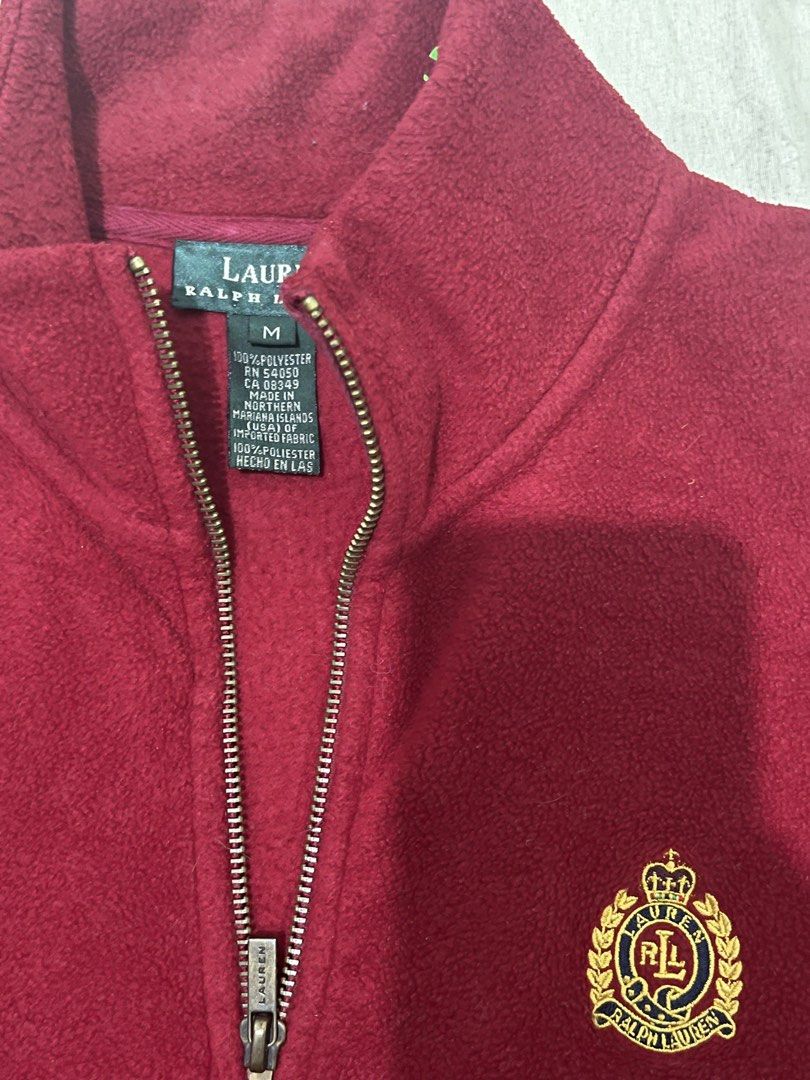 Ralph Lauren Fleece Pullover 1/4 Zip Size M (Category: Coats, Jackets and Outerwear) located in Tabuk. Submitted by collectors_thrift_shop (Listing ID 1448626564, Image 3). Description: - Maroon Ralph Lauren fleece pullover - Size: Medium (M) - Features a quarter zip - Classic RL crest logo on the chest - Material: 100% Polyester - Comfortable and warm, perfect for layering.