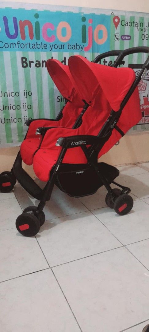 Red Tandem Double Stroller (Category: Strollers) located in Caloocan City. Submitted by Unicoijo02 (Listing ID 1448505246, Image 3). Description: - Red tandem stroller, perfect for two babies. - Easy to maneuver for smooth rides. - Includes a canopy for sun protection. - Features a convenient storage basket underneath. - Folds compactly for easy storage. - Ideal for twins or siblings close in age..