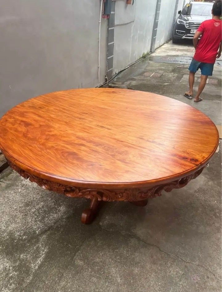 Round table 1Piece top 60inchs narra (Category: Tables & Sets) located in Manila. Submitted by carmelites36250 (Listing ID 1448511337, Image 3). Description: *Round table 8 seaters 60" Dia❤ *1Piece top Solid narra wood 🎯❤ *Beautiful sided Full carvings ✅✅ *Pick up @shop /Delivery 🚚✅🚚 *Pm me ☎☎☎☎ *Price-32000 #forsale.