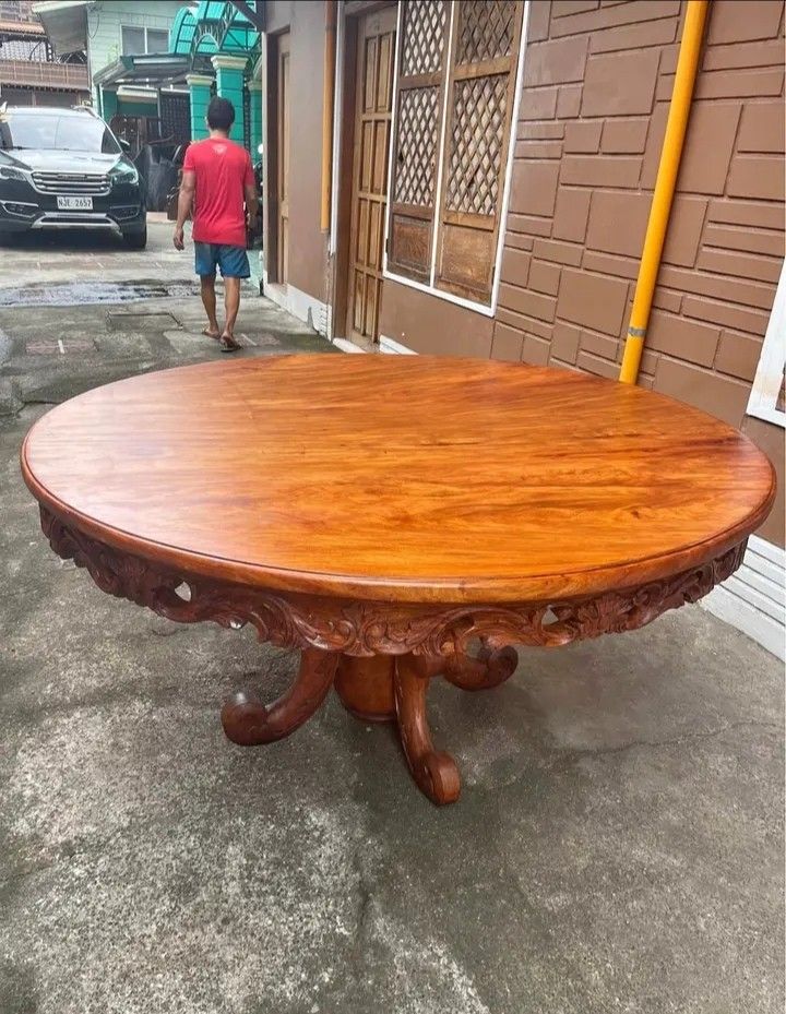 Round table 1Piece top 60inchs narra (Category: Tables & Sets) located in Manila. Submitted by carmelites36250 (Listing ID 1448511337, Image 2). Description: *Round table 8 seaters 60" Dia❤ *1Piece top Solid narra wood 🎯❤ *Beautiful sided Full carvings ✅✅ *Pick up @shop /Delivery 🚚✅🚚 *Pm me ☎☎☎☎ *Price-32000 #forsale.