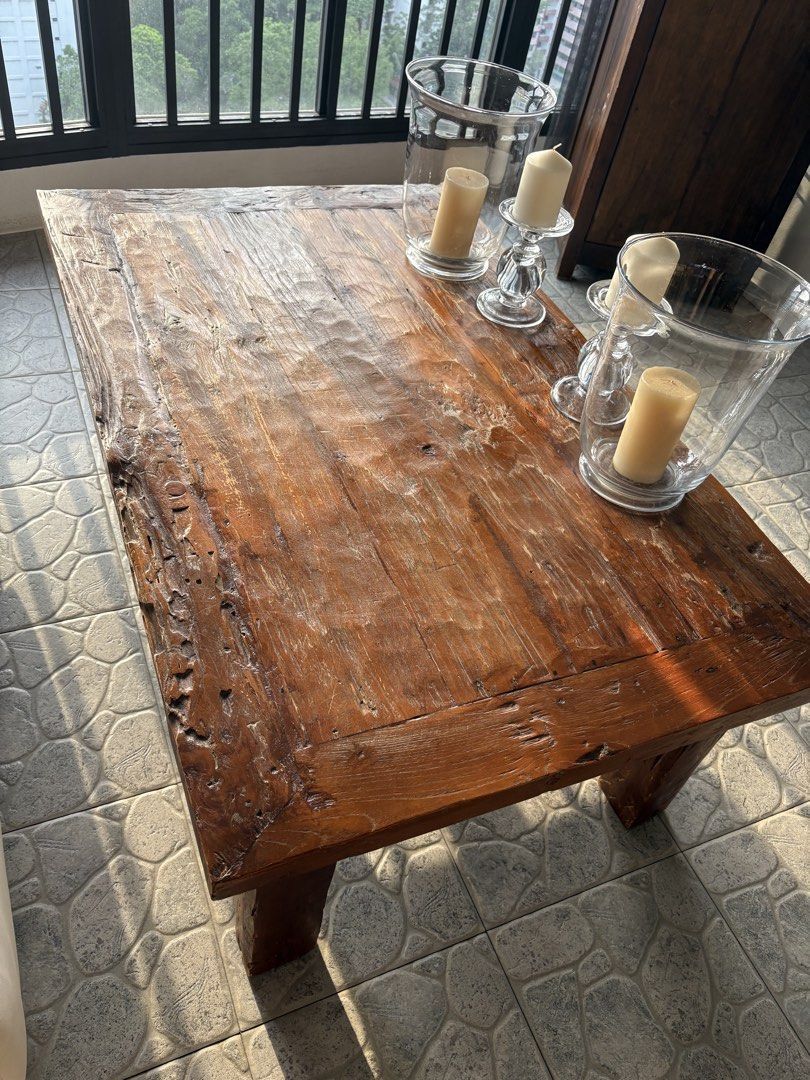 Rustic Solid Wood Coffee Table (Category: Tables & Sets) located in Singapore. Submitted by cecilia1994 (Listing ID 1448631674, Image 1). Description: - Solid wood coffee table - Rustic, natural wood finish with visible grain and unique texture - Thick, sturdy legs for a robust feel - Ideal for living room or lounge area - Dimensions: Approx. L120xB75xH45.