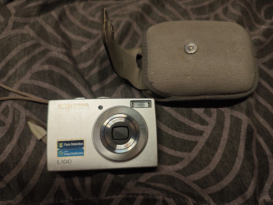 Samsung L100 Digital Camera with Case untested (Category: Cameras) located in Manila. Submitted by jocsssing (Listing ID 1448525087, Image 3). Description: - Samsung L100 Digital Camera - 8.2 Megapixels - Face Detection - Image Stabilization - Silver Color - Includes Protective Case - Includes Strap - Ideal for quick snaps and everyday use.