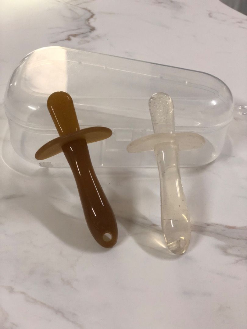 Silicone Pacifiers with Case (Category: Soothers & Pacifiers) located in Makati City. Submitted by luckymoon_065c27 (Listing ID 1448655476, Image 1). Description: - silicone pacifiers (1 brown ,1 clear) - Includes a clear plastic case for storage and travel - Ideal for babies - Easy to clean and durable - Pacifier handles have a hole at the end.