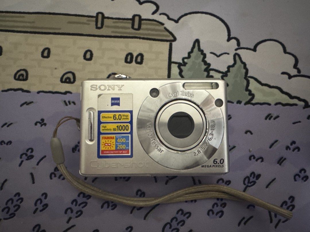 Sony Cyber-shot DSC-W30 Digital Camera (Category: Cameras) located in Manila. Submitted by baristadrinkluvr (Listing ID 1448662195, Image 1). Description: PLEASE READ BEFORE PURCHASE Silver Sony Cyber-shot digital camera - 6.0 megapixels - Carl Zeiss Vario-Tessar lens - Includes wrist strap - LED problem: white screen only - No charger - works when plugged in pero since LED problem siya, need ipagawa .