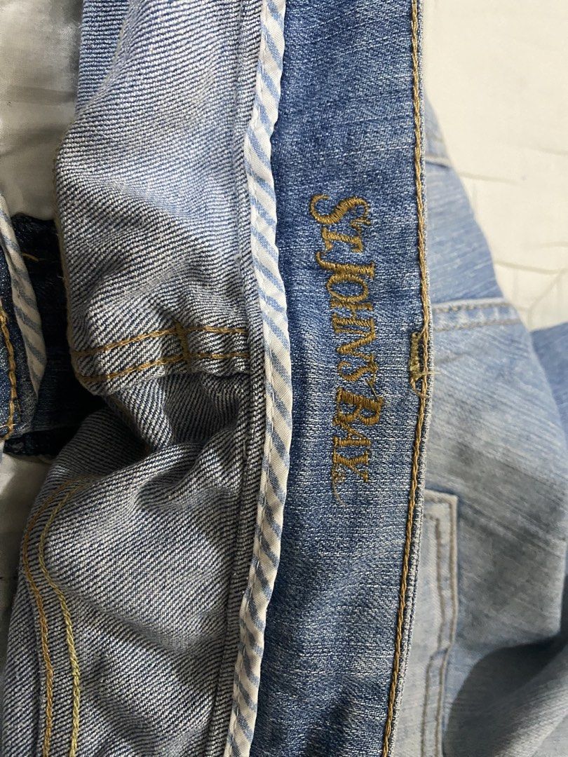 St. John Bay Blue Flare Jeans with Rips (Category: Jeans) located in Naga. Submitted by clidtw (Listing ID 1448529568, Image 2). Description: - Light blue wash with fading - Distressed rips on the right thigh - Flared leg opening - Ideal for a casual outfit.