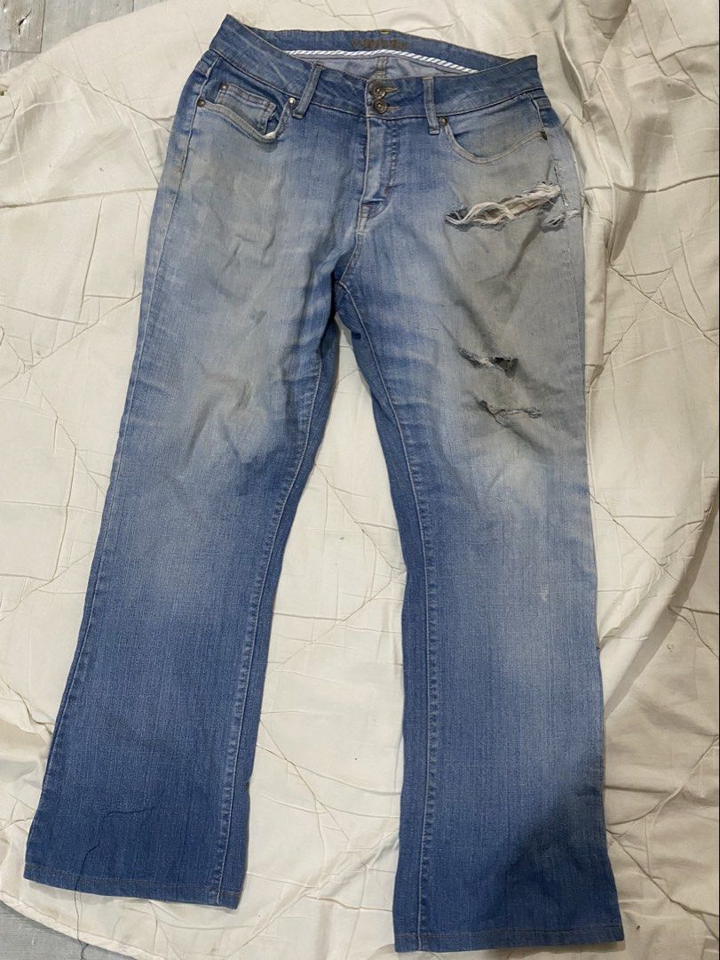 St. John Bay Blue Flare Jeans with Rips (Category: Jeans) located in Naga. Submitted by clidtw (Listing ID 1448529568, Image 1). Description: - Light blue wash with fading - Distressed rips on the right thigh - Flared leg opening - Ideal for a casual outfit.