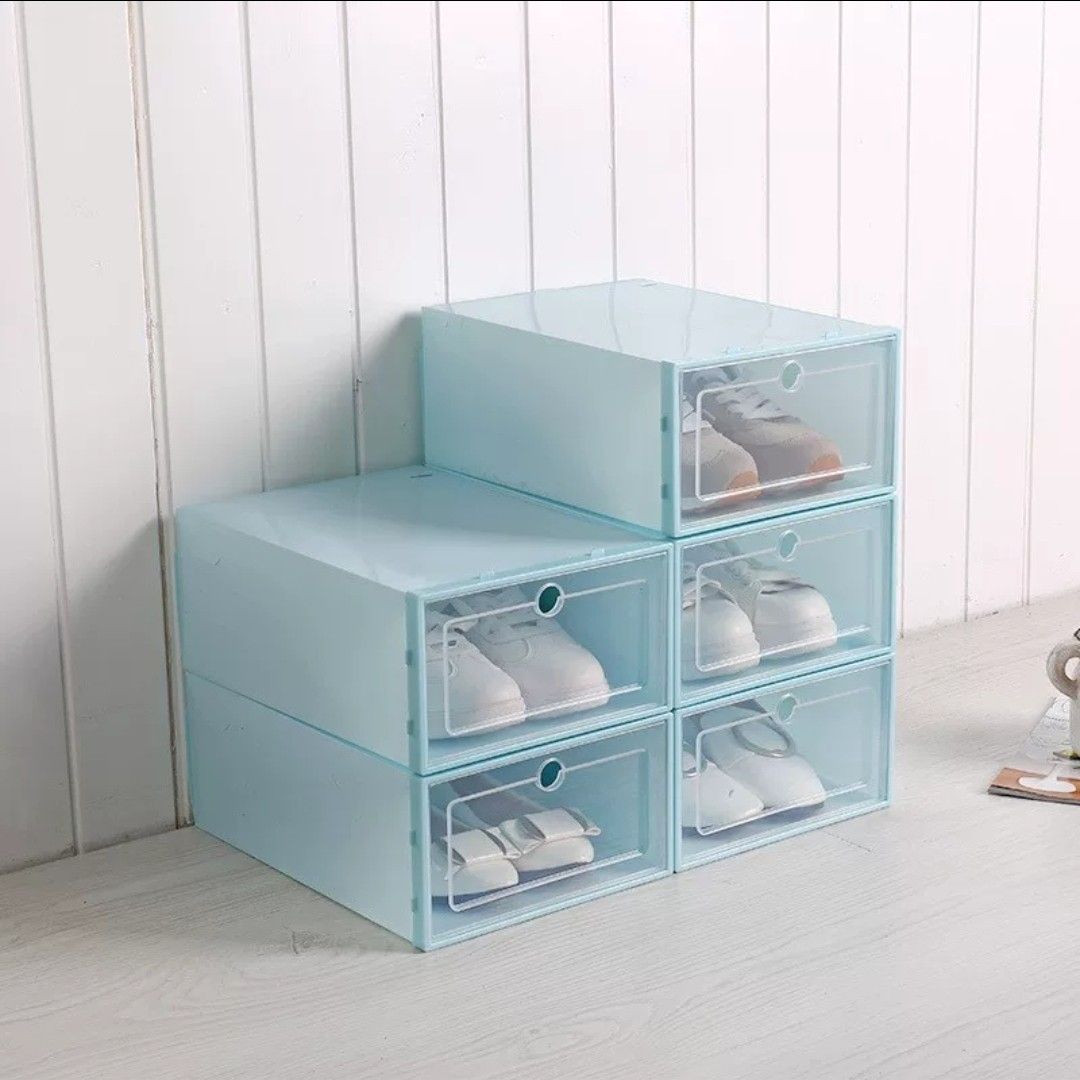 Stackable shoe rack boxes (Category: Shelves, Cabinets & Racks) located in Singapore. Submitted by erica.29 (Listing ID 1448612486, Image 2). Description: Clean and neat aesthetic for your unlimited shoes! Comes in white, red, blue, green! - Easy to assemble - Maximise your room space Minimum 6 boxes per order.