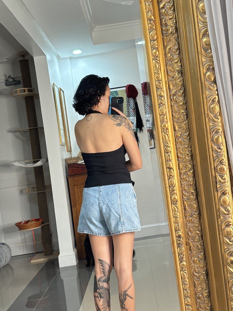 Stradivarius Light Wash Denim Wrap Skirt (Category: Skirts) located in Mandaluyong City. Submitted by aliassaab (Listing ID 1448634991, Image 2). Description: - Stradivarius light wash denim wrap skirt - Features a side button closure - Flattering A-line cut - Versatile for pairing with crop tops or t-shirts - Comfortable and stylish for everyday wear - Size 38.