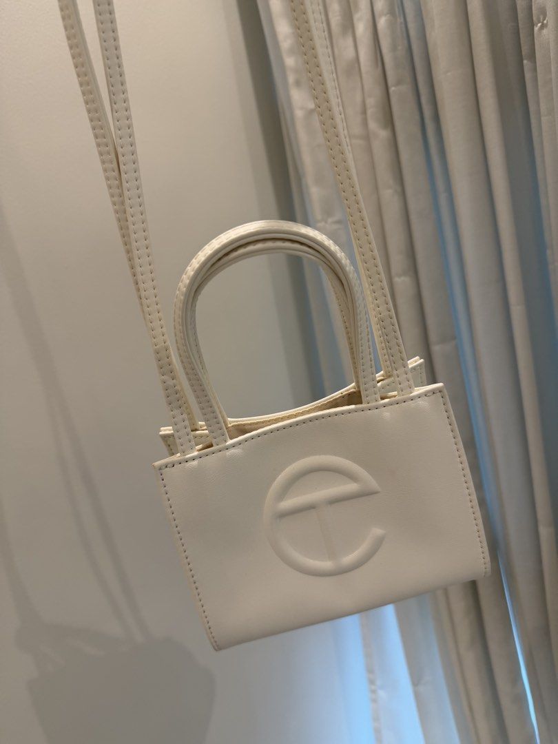 Telfar Small White Shopping Bag (Category: Cross-body Bags) located in Cebu City. Submitted by itemsbysarah (Listing ID 1448582147, Image 2). Description: Authentic Telfar Small White Shopping Bag With dust bag included Bought brand new for 14,000 php Used twice, good as new Minimal stain on the back but barely noticeable, can easily clean up RFS: barely used / not my style anymore ❕Low ballers will not be entertained ❕.