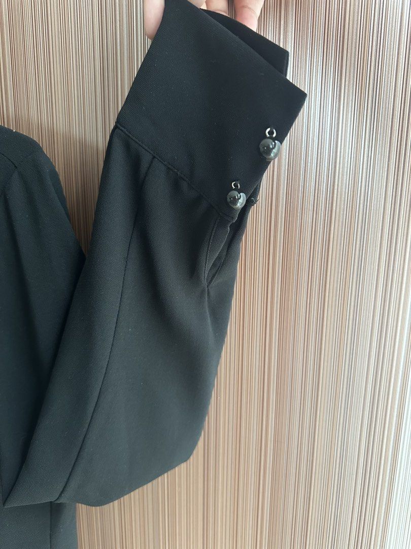 The Black Label Pleated Blouse with Tie Neck (Category: Blouses) located in Taguig. Submitted by stigmapanda (Listing ID 1448693385, Image 3). Description: - Measurements are in cm - Black long-sleeved blouse - Brand: The Black Label - Features: Pleated front, tie neck detail - Closure: Button-down front - Cuffs: Decorative buttons - Estimated Size: S - Style: Dress up or down, versatile .