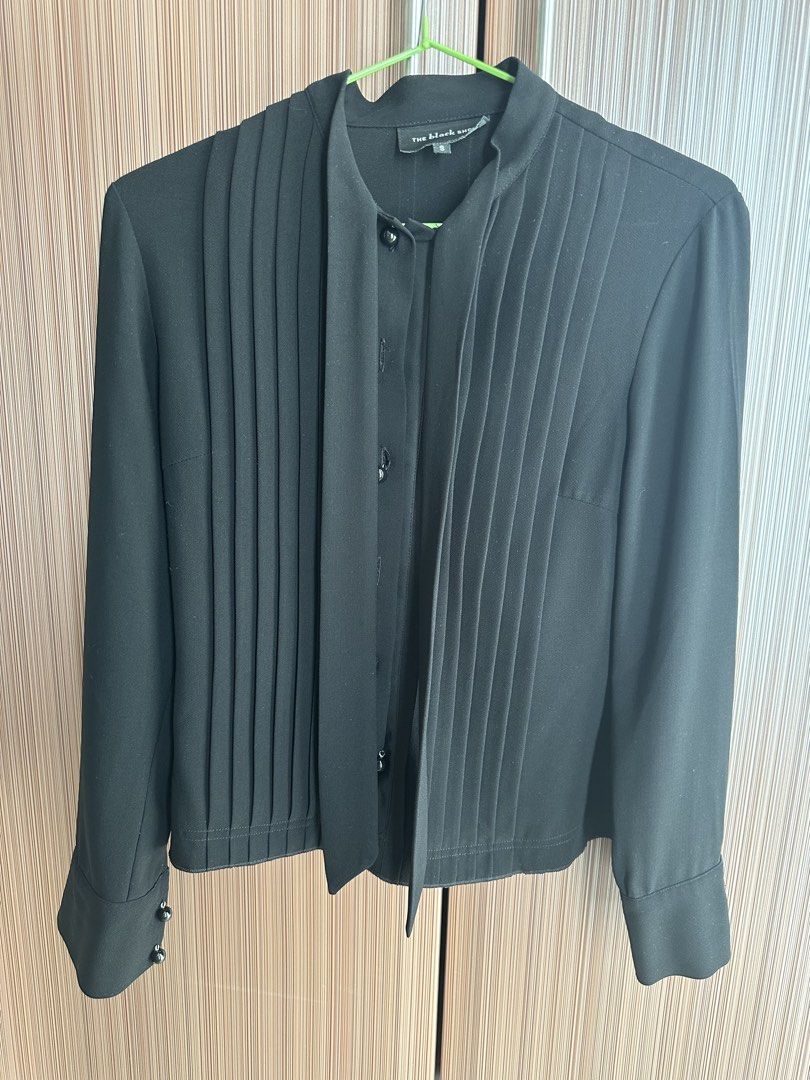 The Black Label Pleated Blouse with Tie Neck (Category: Blouses) located in Taguig. Submitted by stigmapanda (Listing ID 1448693385, Image 1). Description: - Measurements are in cm - Black long-sleeved blouse - Brand: The Black Label - Features: Pleated front, tie neck detail - Closure: Button-down front - Cuffs: Decorative buttons - Estimated Size: S - Style: Dress up or down, versatile .