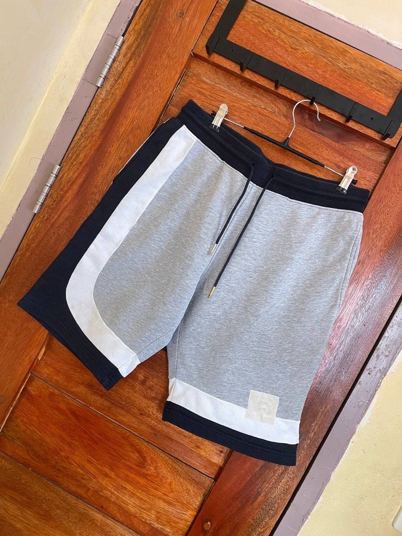Thom Browne Sweat Short (Category: Luxury Apparel) located in Baler. Submitted by revibeee (Listing ID 1448659018, Image 2). Description: FOR SALE THOM BROWNE SWEAT SHORT COLOR NAVY BLUE, WHITE, AND GRAY LIKE NEW CONDITION COLOR RATE 9.5/10 WIDTH 15 TO 19 INCHES | LENGTH 20.5 INCHES CAN FIT SIZE 30 TO 38 WAISTLINE KINDLY CHECK THE PHOTOS FOR THE COMPLETE DETAILS WITH DRAWSTRING AND SIDE POCKETS COMPLETE TAG AND WASH TAG AUTHENTIC |ORIGINAL WASHED
