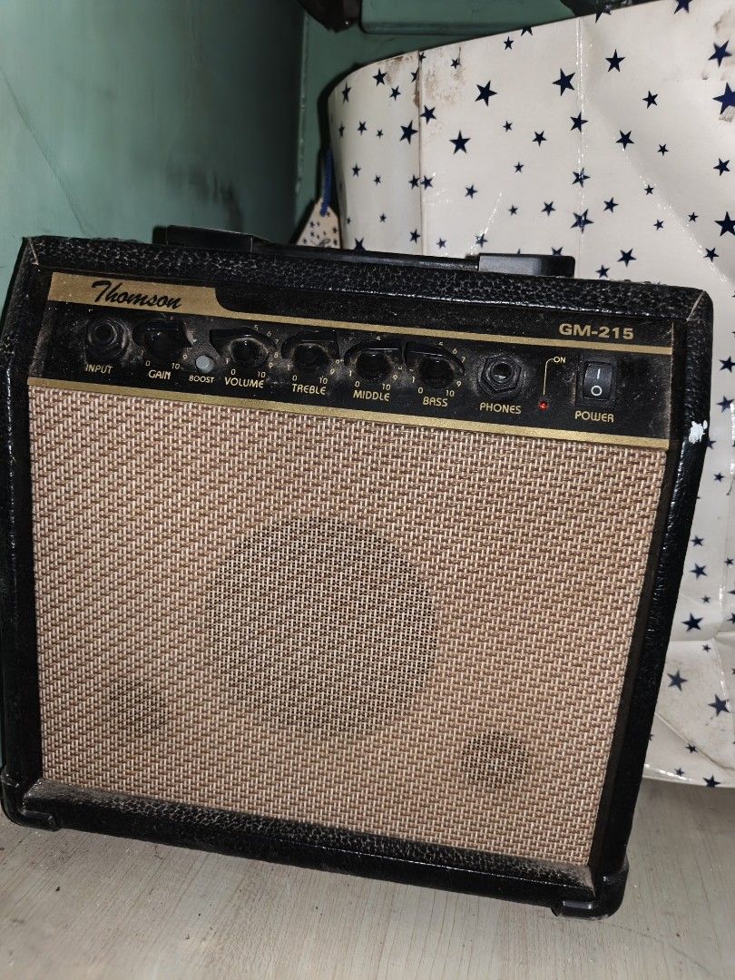 Thomson GM-215 Guitar Amplifier (Category: Musical Instruments) located in Manila. Submitted by hashimama (Listing ID 1448658804, Image 1). Description: - Thomson GM-215 Guitar Amplifier - Ideal for practice sessions or small performances - Controls: Input, Gain, Volume, Treble, Middle, Bass - Includes Headphone Jack for quiet practice - Front-mounted Power Switch - Tested and confirmed to be in working condition RFS: no longer used.