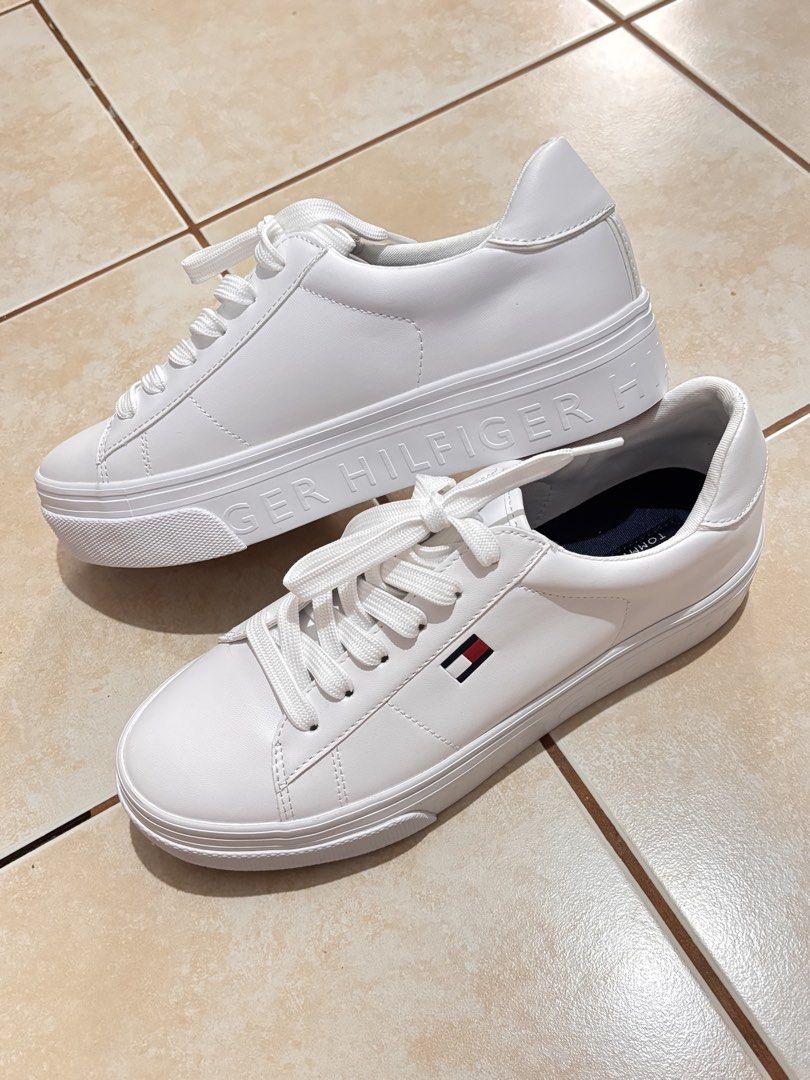 Tommy Hilfiger White Bueri Sneakers (Category: Sneakers) located in Manila. Submitted by 12essentials (Listing ID 1448546940, Image 1). Description: - Bought in WINNERS CANADA 🇨🇦 - Brand New but no hang tag - Model numer: TWBUERI-WHI01-140 - White Tommy Hilfiger platform sneakers - Classic lace-up style - Features Tommy Hilfiger logo on the side - Embossed full logo on the platform sole - Clean and classic look - Ideal for casual wear.
