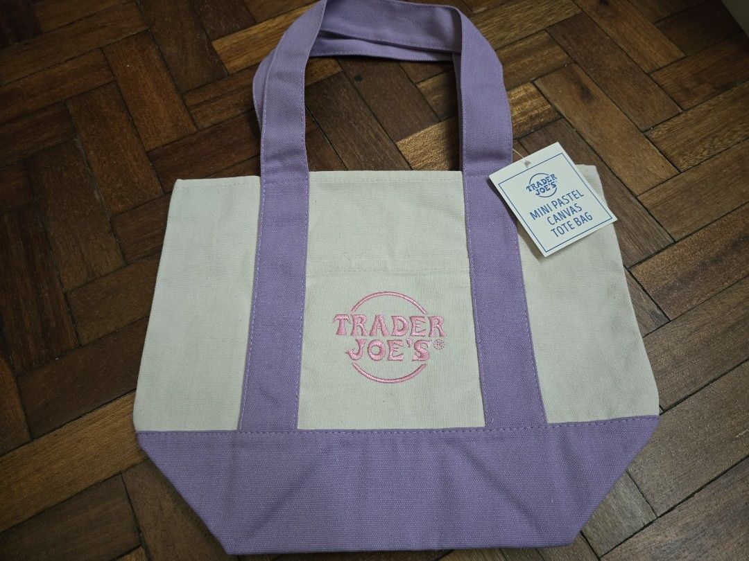 Trader Joe's Mini Pastel Canvas Tote Bag (Category: Tote Bags) located in Quezon City. Submitted by dridri09 (Listing ID 1448544897, Image 3). Description: - Pastel colors: light blue, pastel green, and light pink - Features embroidered Trader Joe's logo on each bag - Ideal for carrying small groceries or everyday essentials - Compact and easy to carry.