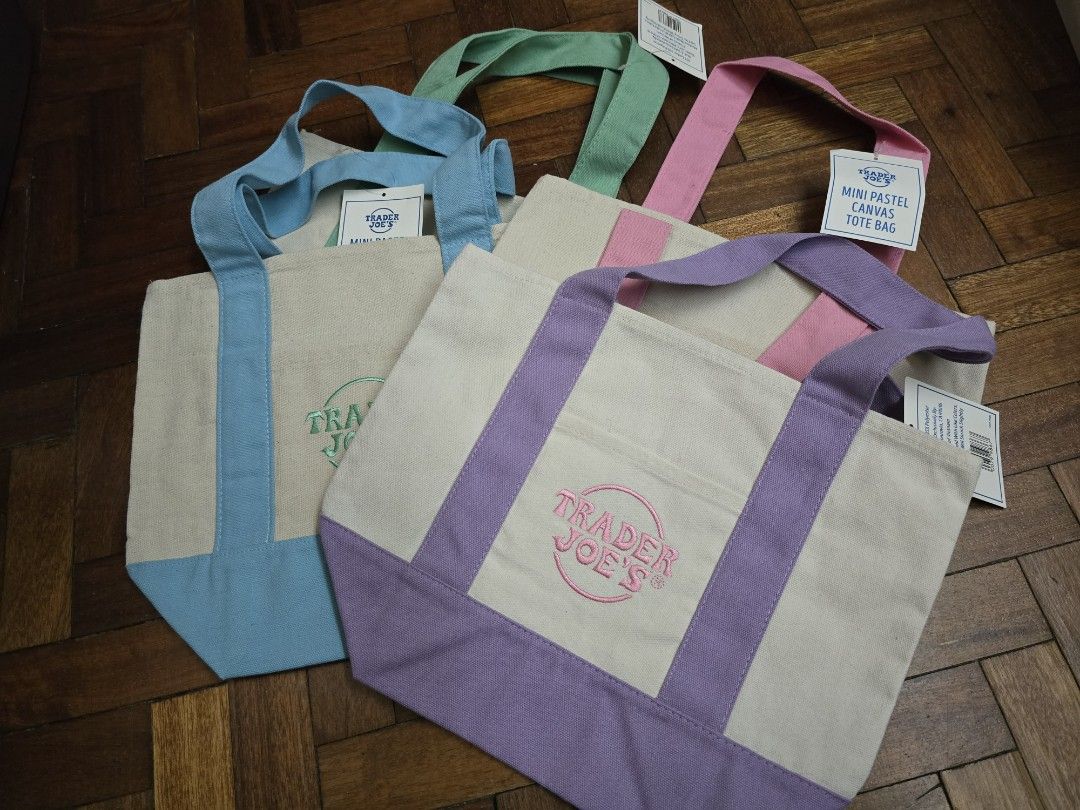 Trader Joe's Mini Pastel Canvas Tote Bag (Category: Tote Bags) located in Quezon City. Submitted by dridri09 (Listing ID 1448544897, Image 2). Description: - Pastel colors: light blue, pastel green, and light pink - Features embroidered Trader Joe's logo on each bag - Ideal for carrying small groceries or everyday essentials - Compact and easy to carry.