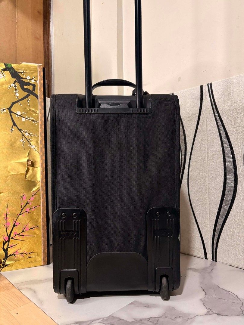 Tumi Alpha 2 Small Luggage Imported from Japan (Category: Luggage) located in Manila. Submitted by jzjapansurplus (Listing ID 1448660541, Image 3). Description: - Black Tumi Alpha 2 small luggage - Imported from Japan - Dimensions: 23x14x9 inches - Durable and reliable for travel - Retractable handle and wheels for easy transport - Ample space for essentials - Ideal for short trips or as a carry-o 🇯🇵IMPORTED FROM JAPAN TUMI ALPHA 2 SMALL LUGGAG