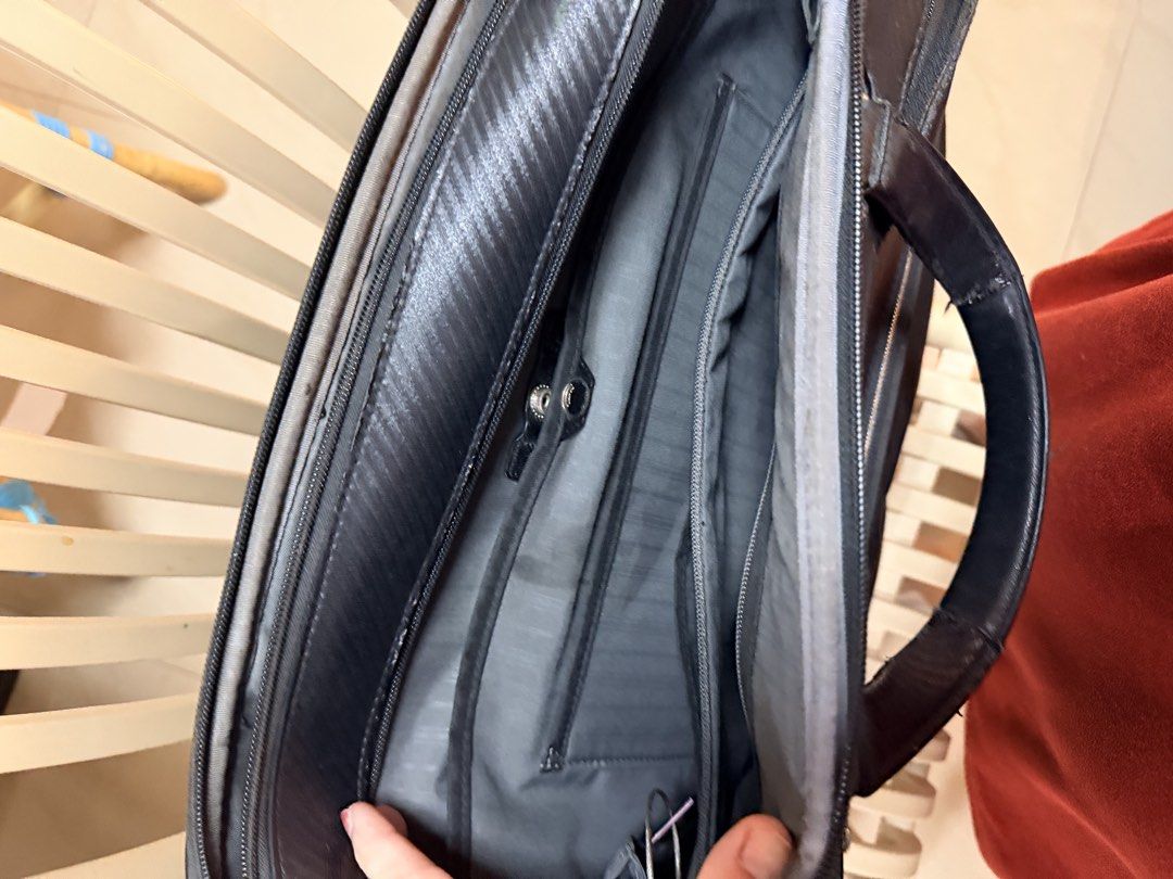 Tumi Black Leather and Nylon Briefcase with Shoulder Strap (Category: Briefcases) located in Pasay City. Submitted by marge.chang (Listing ID 1448672018, Image 3). Description: - Brand: Tumi - Color: Black - Material: Leather and Nylon - Features: Main compartment, front zip pocket - Includes: Detachable shoulder strap, leather tag, paper bag - Ideal for: Work and travel.