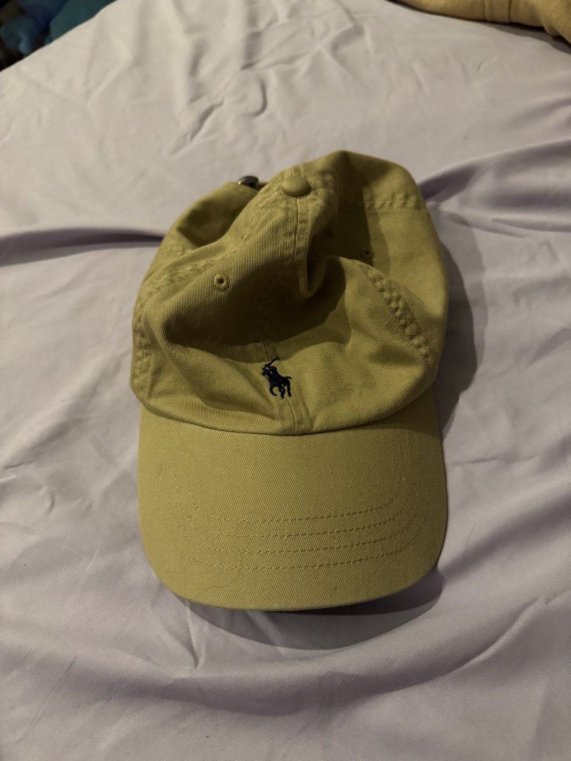 UNISEX Polo Ralph Lauren Cap (Category: Other Accessories) located in Pasay City. Submitted by michinita17 (Listing ID 1448600161, Image 1). Description: - Classic Polo Ralph Lauren cap - Khaki color - Iconic embroidered polo player logo - Adjustable strap at the back - Comfortable fit - Ideal for everyday casual outfits.