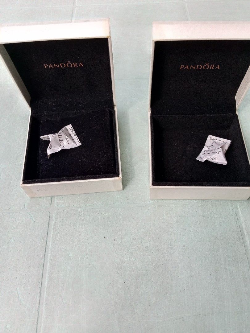 Used 2 Pandora Jewelry Boxes White (Category: Accessory Holder, Box & Organizers) located in Marikina City. Submitted by norman213 (Listing ID 1448551948, Image 1). Description: - Two white Pandora jewelry boxes - Empty, perfect for storage - Includes original silica gel packets - Ideal for Pandora charms or small jewelry - Ready for a new home.