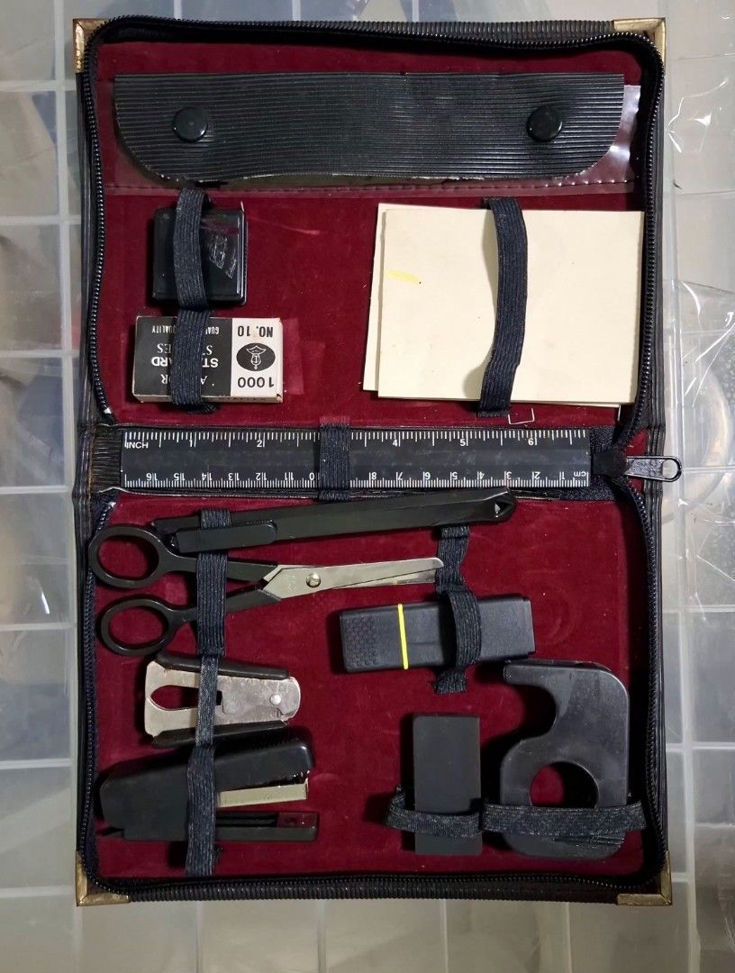 Vintage Black Portable Stationery Kit with Tools (Category: Stationery & School Supplies) located in Don Carlos. Submitted by PphiXi_Finds (Listing ID 1448582097, Image 3). Description: - Compact black stationery kit - Includes scissors, stapler, ruler, paper clips, rubber bands, and note paper - Small pouch with school supplies (paper clips, rubberband - Durable brass corner protectors - Secure zipper closure - Ideal for travel or desk organizat