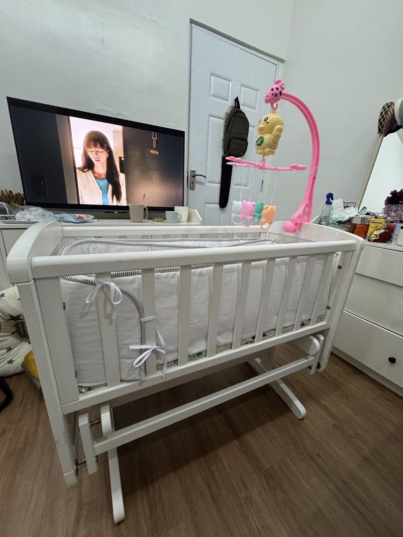 White Baby Crib with Mobile and Glider Base (Category: Cots & Cribs) located in Manila. Submitted by deddelyn (Listing ID 1448496588, Image 1). Description: Bought this on Mother Care Store Shangrila ( solid wood) almost 20k original price, selling now 6900 only, crib only, yung side bedding 3k sa sm mega mall na bili kahit 1500 na lang then yung foam free na. Head pillow and 2 long pillows 500 na lang nabili ko don ng 2k sa megamall. You’ll sa p