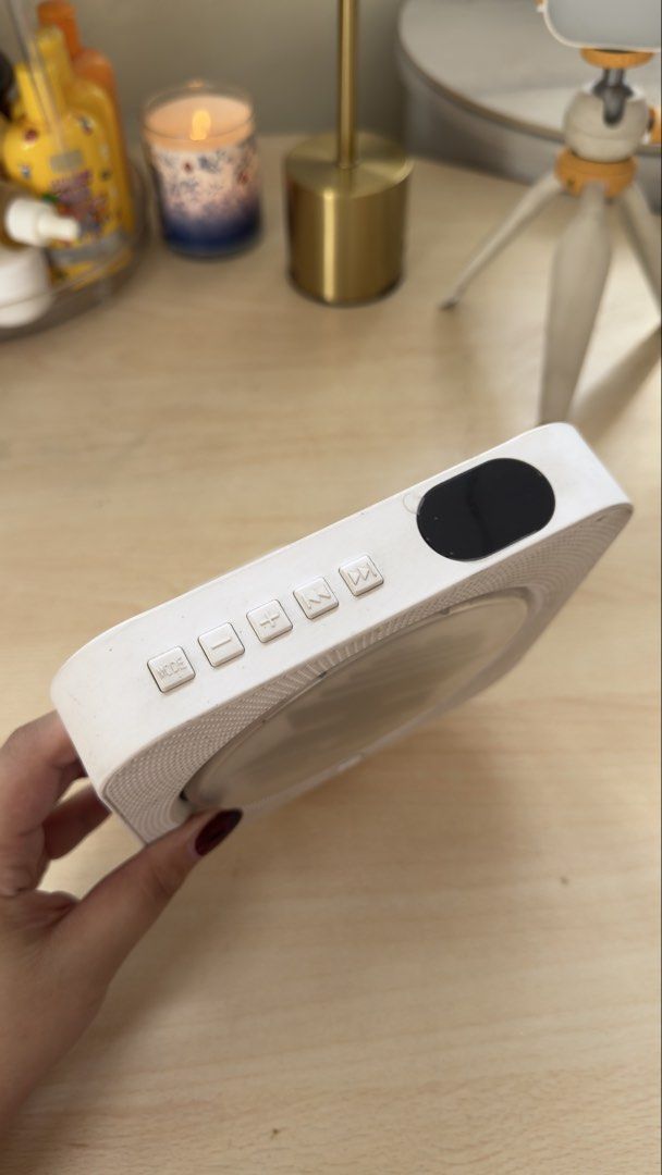 White Portable CD Player with BTS CD (Category: Portable Music Players) located in Santa Rosa. Submitted by ninjalei (Listing ID 1448550876, Image 2). Description: - White portable CD player - free BTS CD - Side buttons for mode, volume, and playback - Built-in stand on the back - Ideal for enjoying your music on the go.