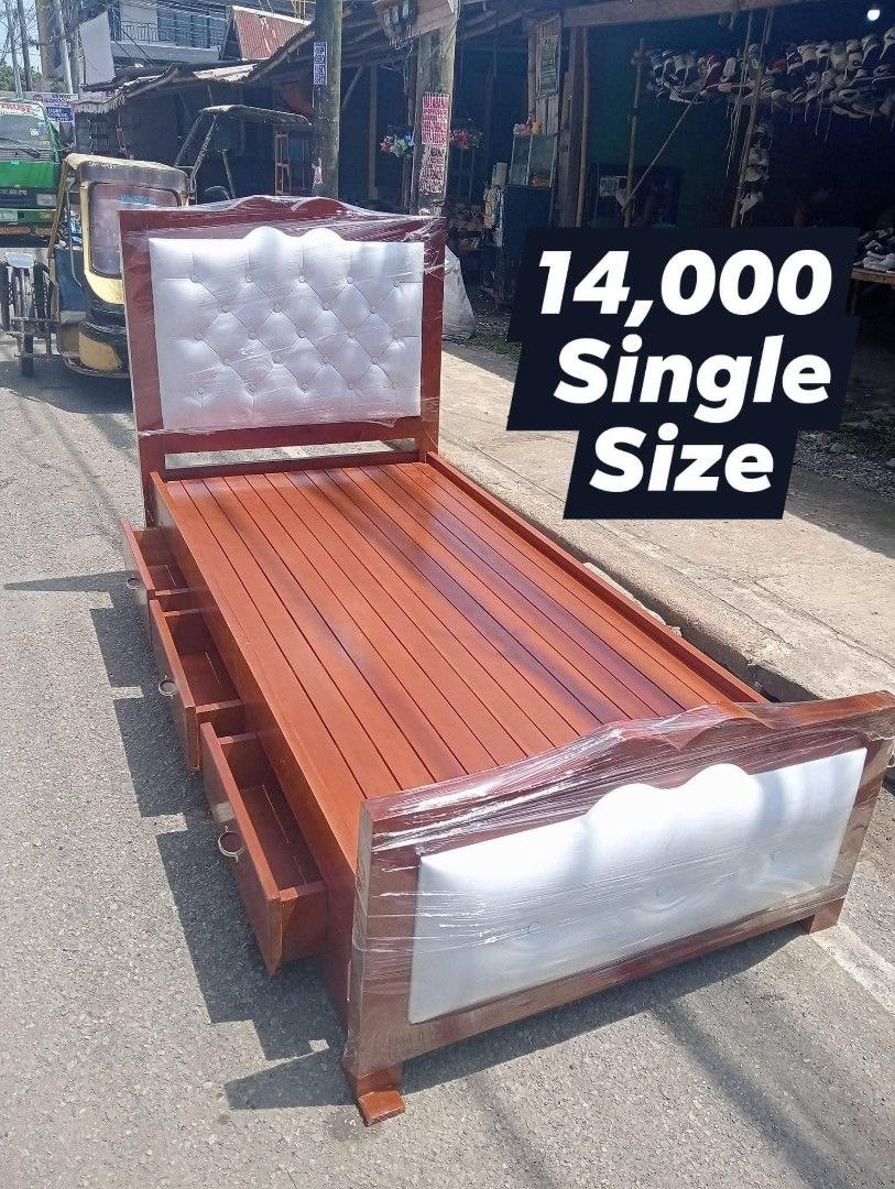 Wooden Bed Frame with Upholstered Headboard - Double & Single Sizes (Category: Bed Frames & Mattresses) located in Iloilo. Submitted by semicglinda (Listing ID 1448606343, Image 2). Description: - Wooden bed frames available in Double and Single sizes. - Features a rich wood finish. - Includes a stylish tufted upholstered headboard. - Built-in drawers offer convenient extra storage. - Ideal for any bedroom setting. - Message us for specific size 