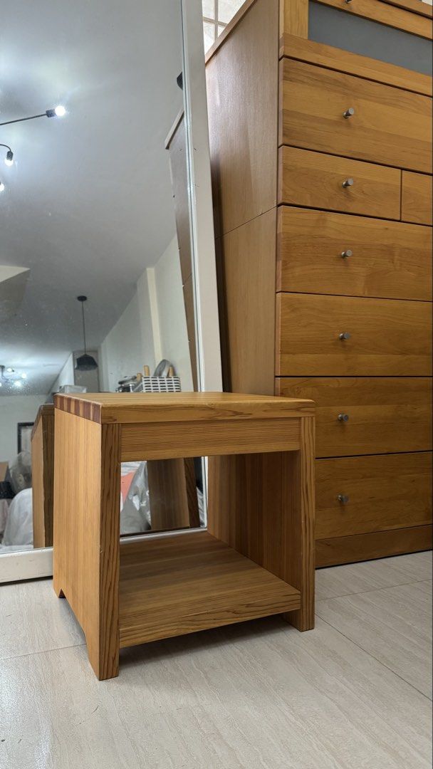 Wooden Side Table with Shelf (Category: Tables & Sets) located in Quezon City. Submitted by elektra0111 (Listing ID 1448654686, Image 1). Description: - Solid wood construction - Features an open shelf for storage - Minor scuffs on the tabletop from normal use - Ideal as a bedside table or plant stand - Simple and sturdy design - Ready for its new home.