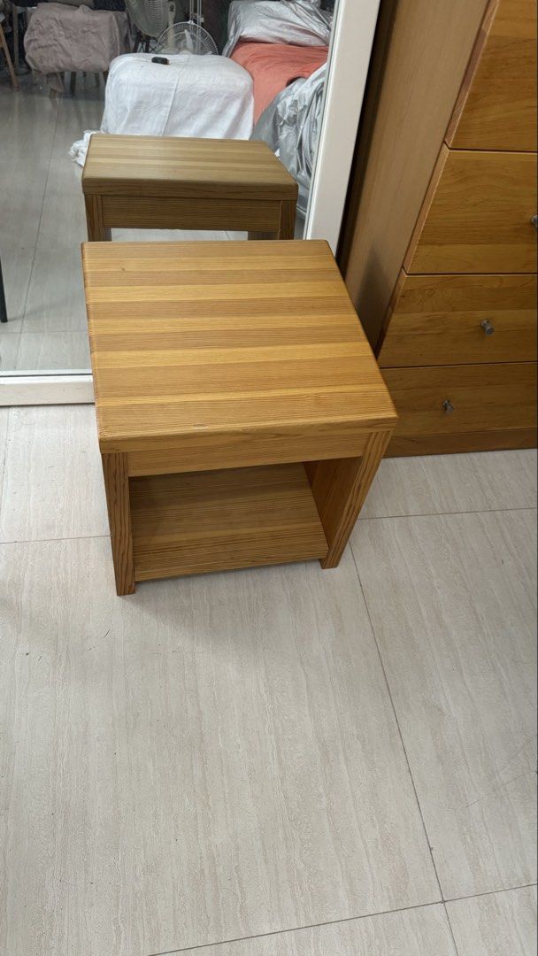Wooden Side Table with Shelf (Category: Tables & Sets) located in Quezon City. Submitted by elektra0111 (Listing ID 1448654686, Image 3). Description: - Solid wood construction - Features an open shelf for storage - Minor scuffs on the tabletop from normal use - Ideal as a bedside table or plant stand - Simple and sturdy design - Ready for its new home.