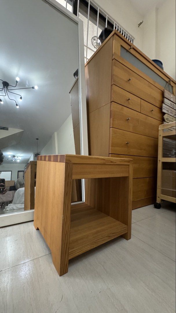 Wooden Side Table with Shelf (Category: Tables & Sets) located in Quezon City. Submitted by elektra0111 (Listing ID 1448654686, Image 2). Description: - Solid wood construction - Features an open shelf for storage - Minor scuffs on the tabletop from normal use - Ideal as a bedside table or plant stand - Simple and sturdy design - Ready for its new home.