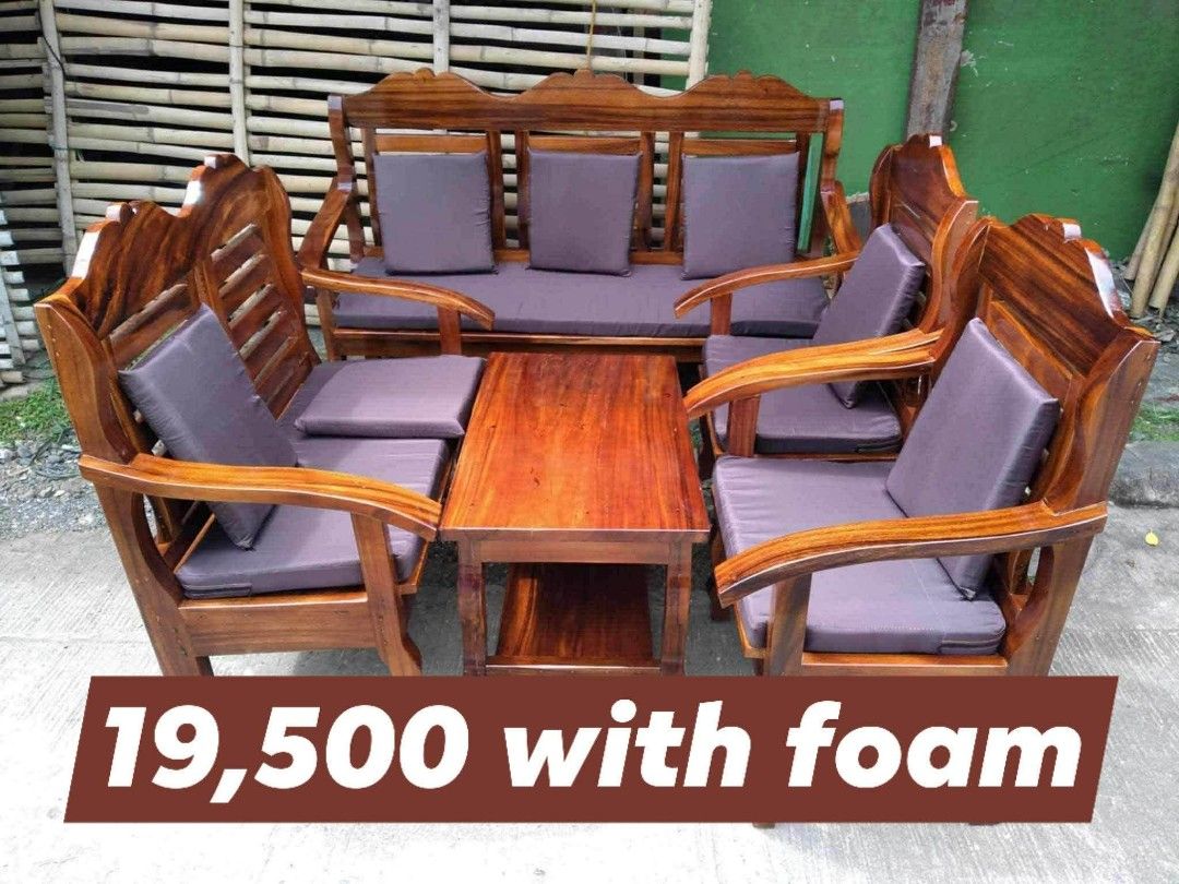 Wooden Sofa Set with Coffee Table and Cushions (Category: Sofas) located in Iloilo. Submitted by semicglinda (Listing ID 1448601212, Image 1). Description: - Solid wood sofa set - Includes: 3-seater sofa, two armchairs, and a coffee table - Comes with comfortable dark grey cushions (foam included) - Features a beautiful, rich wood finish - Sturdy and well-built construction - Ideal for both indoor living rooms and outdoor patios.