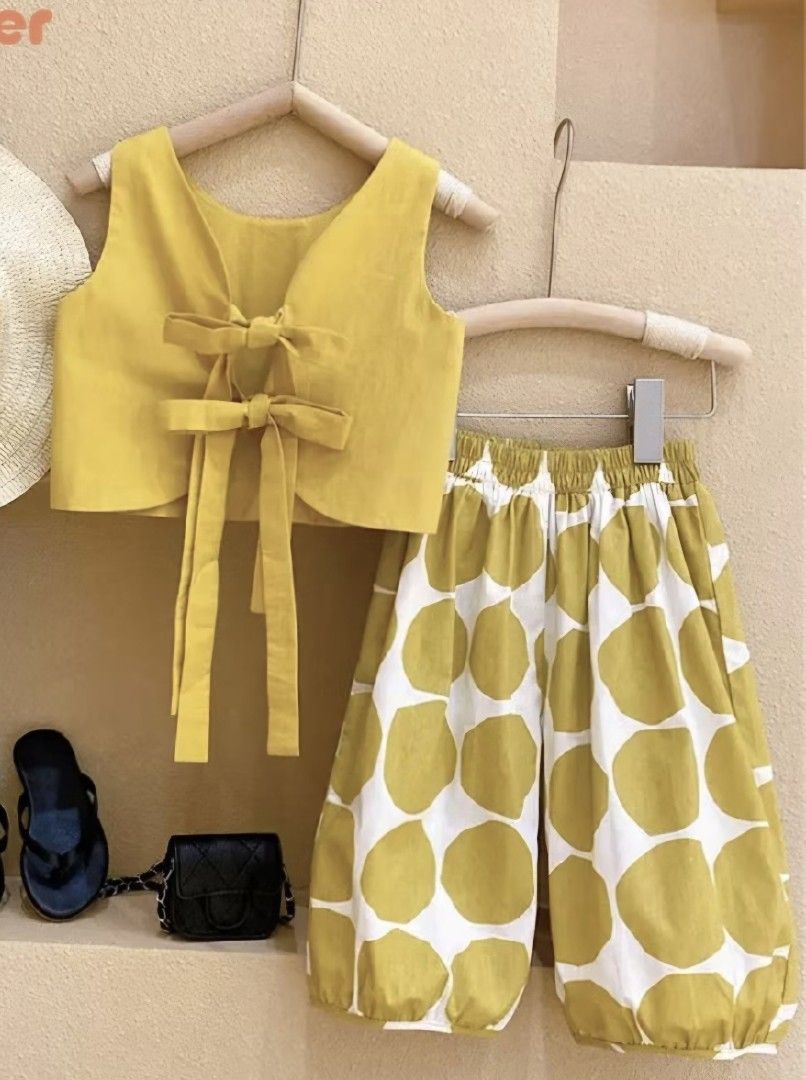 Yellow Bow Top and Polka Dot Pants Set (Category: Babies & Kids Fashion) located in Batangas. Submitted by marthy2009 (Listing ID 1448520761, Image 1). Description: - Adorable yellow sleeveless top with bow details. - Comfy yellow and white polka dot pants. - Elastic waistband for easy wear and comfort. - Ideal for casual outings and playdates. - Your child will surely love this outfit!.