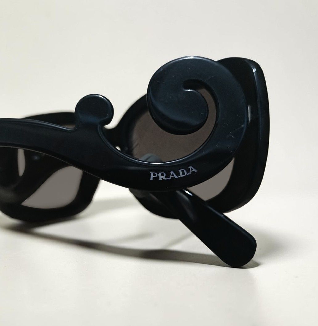 Auth Prada Baroque Sunglasses (Category: Luxury Accessories) located in Manila. Submitted by eternelley (Listing ID 1453058503, Image 2). Description: RFS: Too many sunglasses. LP: 4,000 PHP - Comes with original box and case Issues: -Sa sunglasses, may scratches, and lightly loose sa may temple area. -'Yong box is may slight punit na. -The case has a minimal stain. MOP: GCash or Maribank MOD: JNT.