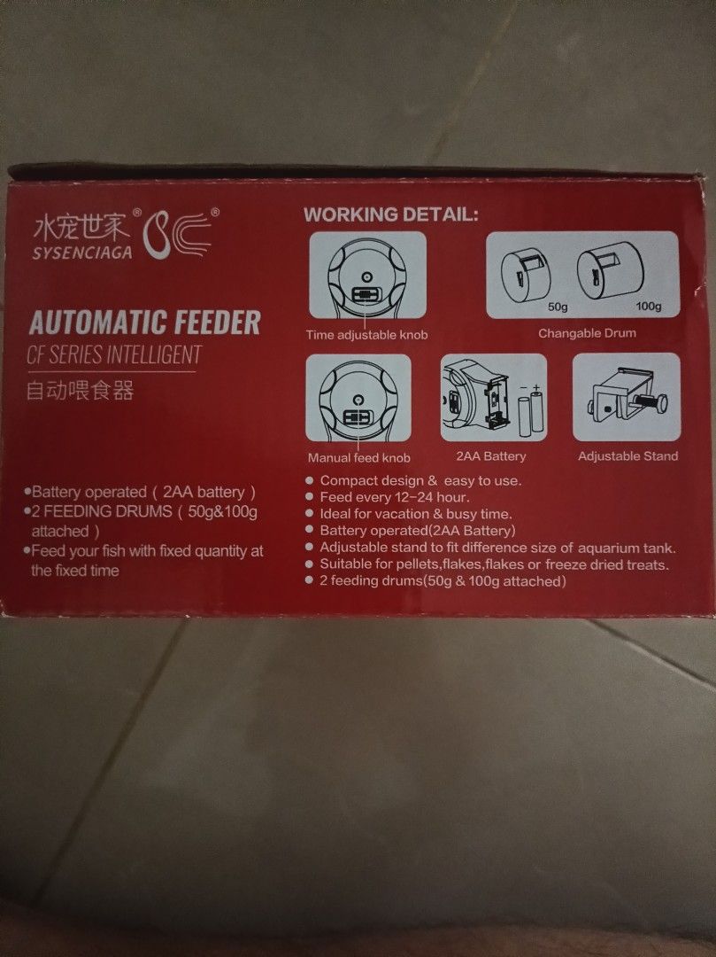 Automatic feeder (Category: Homes & Other Pet Accessories) located in Singapore. Submitted by yeoggie_bear (Listing ID 1453065307, Image 2). Description: - SYSENCIAGA CF Series Intelligent Automatic Feeder - Battery operated (2 AA batteries required) - Comes with two feeding drums: 50g and 100g - Programmable feeding schedule: feed every 12-24 hours - Suitable for various fish food types: pellets, flakes, freeze-dried treats - Features an adjusta