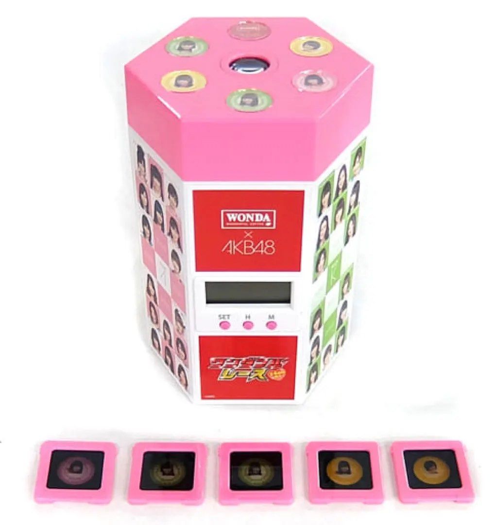 B014 WONDA x AKB48 "Wonderful Race" Projector Clock (Category: Toys & Collectibles) located in Angeles City. Submitted by zyeplustradings (Listing ID 1453063276, Image 3). Description: WONDA x AKB48 “Wonderful Race” Projector Clock The device is designed to project images of winning team members onto a surface, in addition to functioning as a regular clock. It features a hexagonal design with a pink top and displays pictures of various AKB48 memb