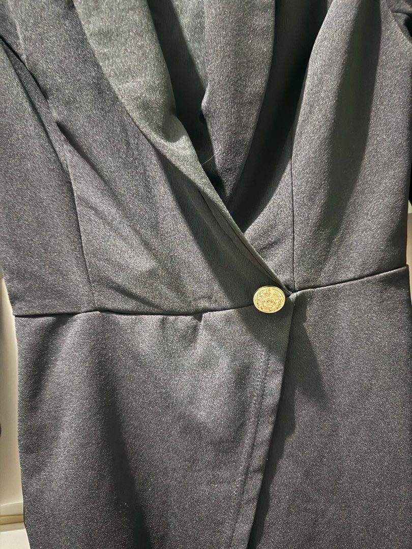 Black Blazer Romper (Category: Rompers) located in Manila. Submitted by RyzelHachi (Listing ID 1453226147, Image 3). Description: - Stylish black romper - Features a chic shawl collar - Flattering wrap front design - Elegant gold button closure - Long sleeves for a sophisticated look - Versatile: dress up or down.