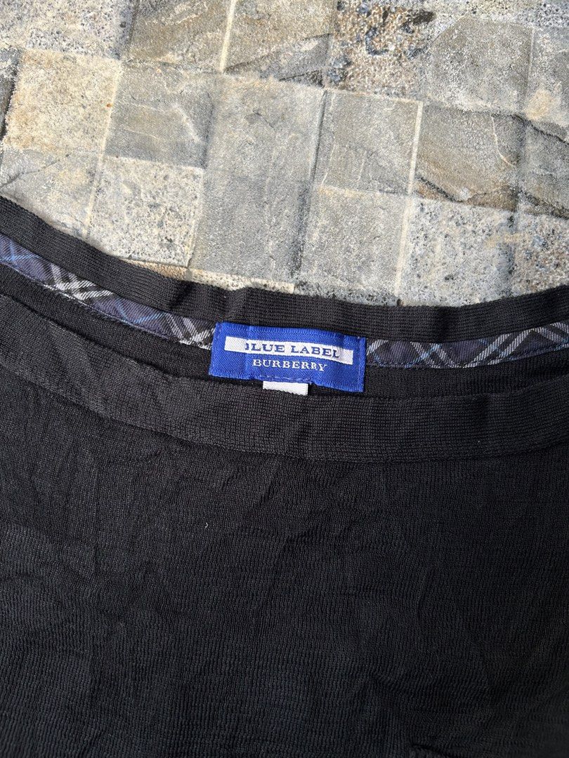 Burberry Blue Label Black Knitted Sweater (Category: Coats, Jackets and Outerwear) located in Quezon City. Submitted by commonwealthpickerph (Listing ID 1453130471, Image 3). Description: Authentic Burberry Blue Label black long-sleeved sweater - 18 width // 22 length - Elegant gold button details on the shoulder - Convenient small chest pocket - Subtle Burberry plaid lining inside the neckline - Soft and comfortable knit fabric - Perfect for ver