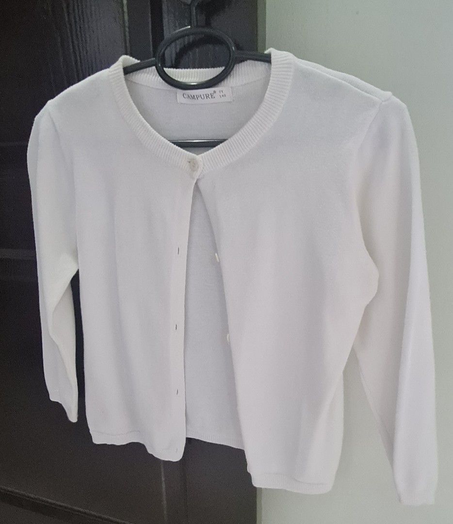 Campure White Button Up Cardigan - Kids (Category: Babies & Kids Fashion) located in Manila. Submitted by eithne128 (Listing ID 1453101122, Image 1). Description: - White Campure cardigan - Long sleeves with button-up front - Ribbed cuffs and hem - Simple and classic design - Perfect for layering over tops or dresses - Size 140.