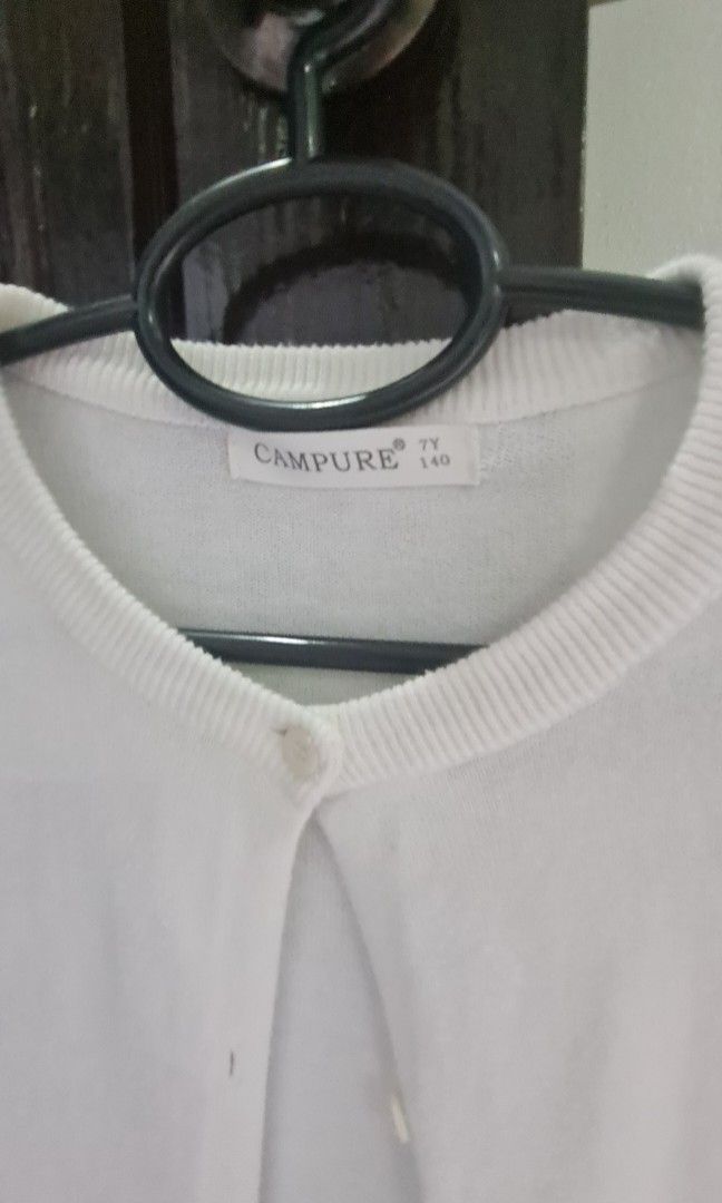 Campure White Button Up Cardigan - Kids (Category: Babies & Kids Fashion) located in Manila. Submitted by eithne128 (Listing ID 1453101122, Image 2). Description: - White Campure cardigan - Long sleeves with button-up front - Ribbed cuffs and hem - Simple and classic design - Perfect for layering over tops or dresses - Size 140.