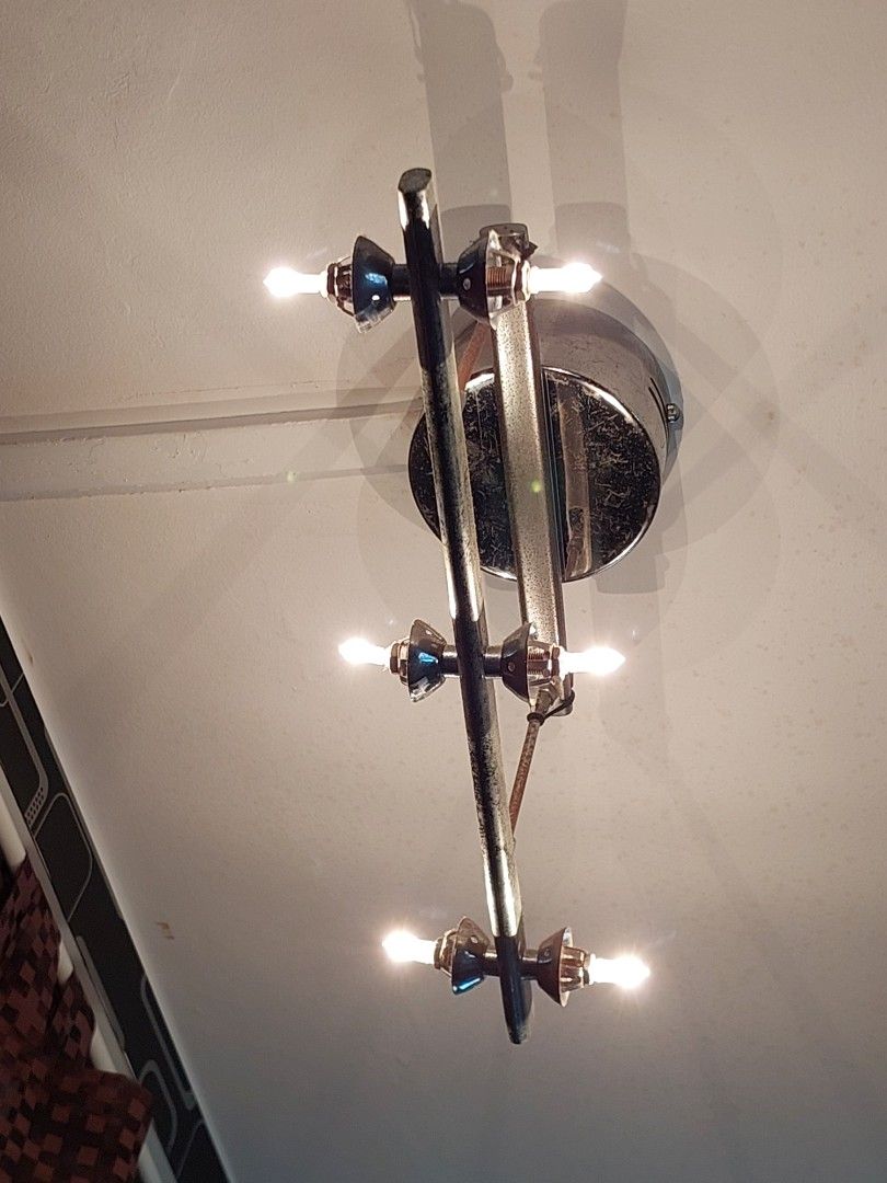 Ceiling light (Category: Lighting) located in Singapore. Submitted by dailylife66 (Listing ID 1453208276, Image 1). Description: - Unique 6-light wall sconce - Chrome and metal finish - Candle-style bulbs included - Adds a vintage vibe - Ideal for hallways or living areas PM for more pictures. I have some bulbs included. Will give out all..